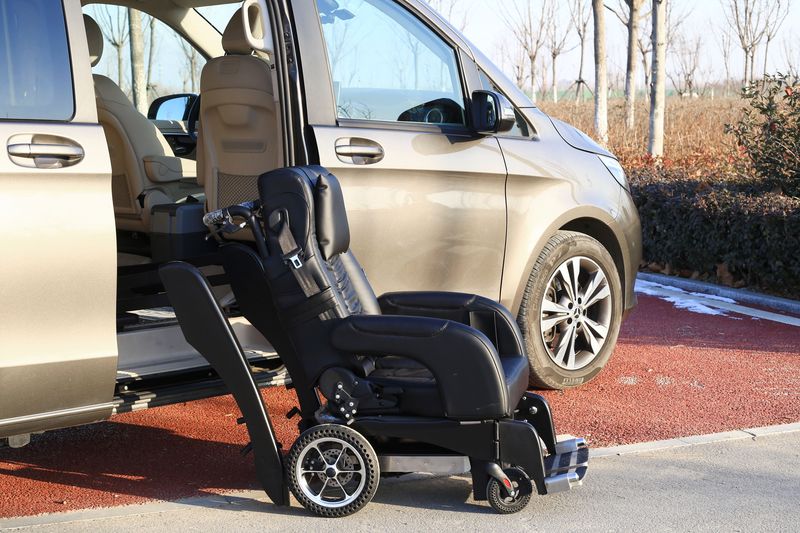 Wheelchair beside a passenger van with its sliding door open
